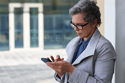 Buy stock photo Businesswoman, typing and outdoor in city with phone, check schedule or email notification for work. Mature person, scroll and reading in urban town with tech, text message or online calendar for job