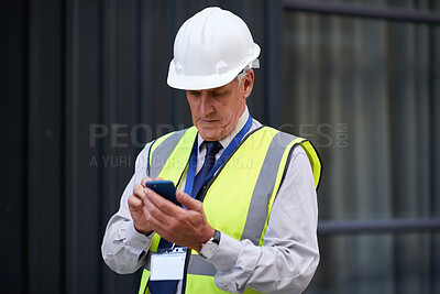 Buy stock photo Cellphone, man and construction manager on site with email for feedback on city maintenance or repairs. Phone, reading and mature male civil contractor with mobile app for review on building approval