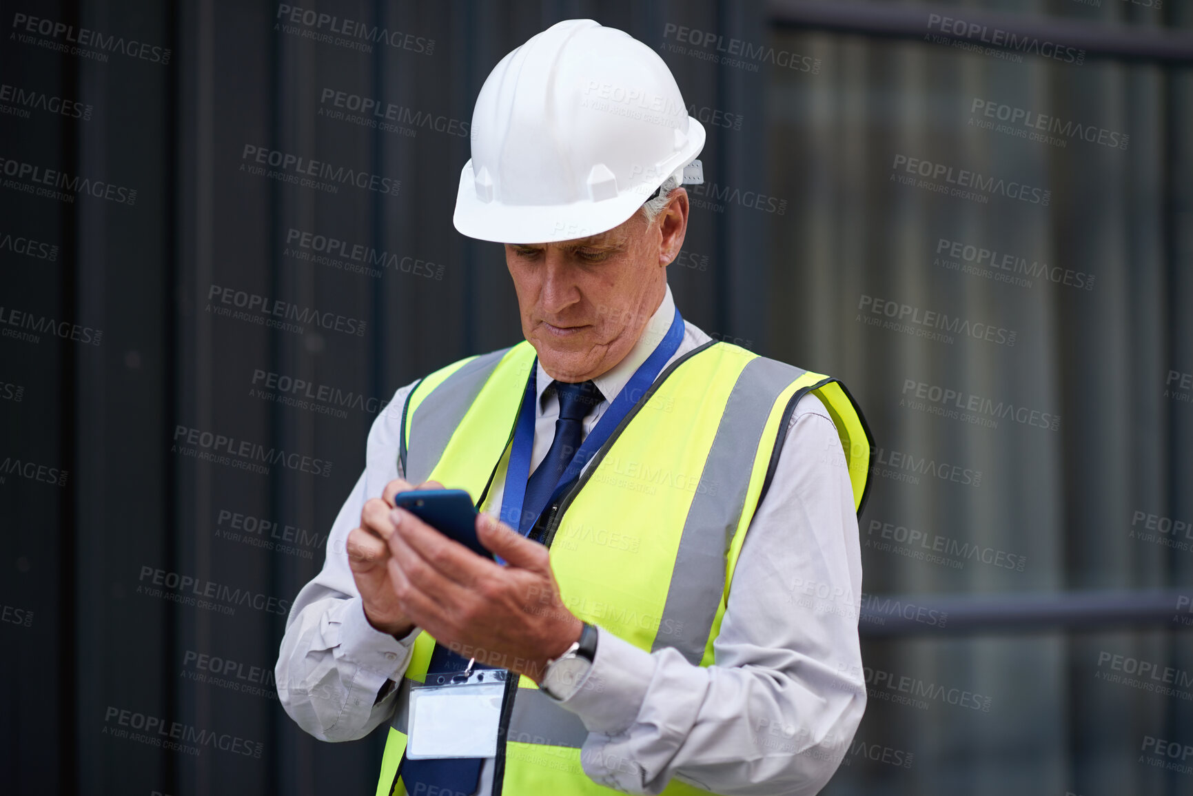 Buy stock photo Cellphone, man and construction manager on site with email for feedback on city maintenance or repairs. Phone, reading and mature male civil contractor with mobile app for review on building approval
