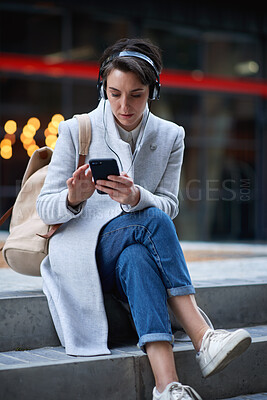 Buy stock photo Outdoor, phone and business woman with headphones, subscription service and browsing internet. Mobile, employee and person in city with music for podcast, audio app and text message with bokeh