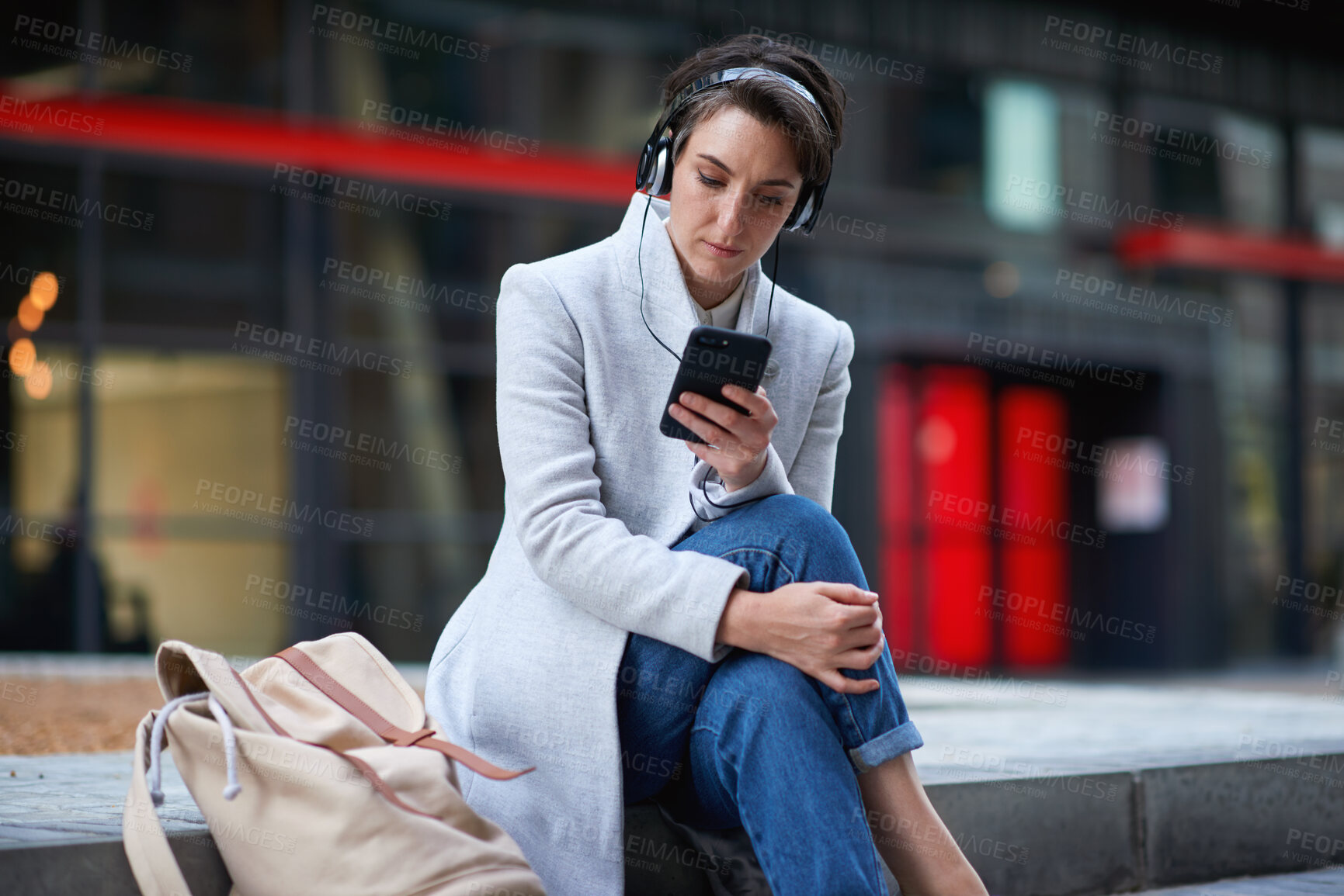 Buy stock photo Outdoor, phone and business woman with music, subscription service and browsing internet. Mobile, employee and person in city with headphones for podcast, audio app or text message on morning commute