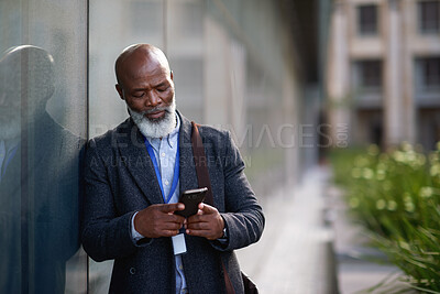 Buy stock photo Business, phone and black man in city for work commute, communication and travel with typing. Mature person, cellphone and texting or message to contact for feedback, space or serious outdoor