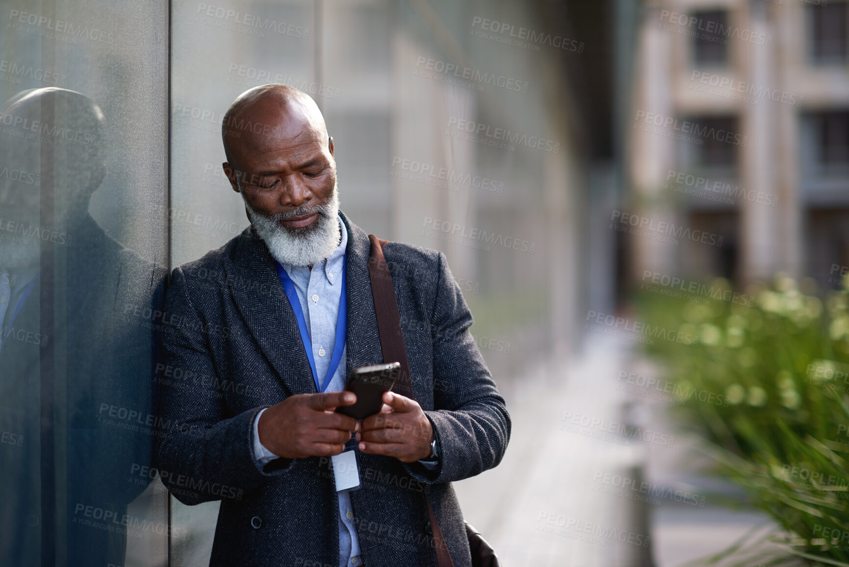 Buy stock photo Business, phone and black man in city for work commute, communication and travel with typing. Mature person, cellphone and texting or message to contact for feedback, space or serious outdoor