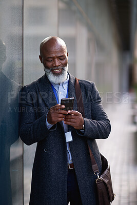 Buy stock photo Happy, business or black man in city with phone, deal close or good news in morning commute. Smile, text or mature property agent with tech, listing approval or investment opportunity at start of day