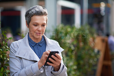 Buy stock photo Mature, phone and business woman in city for work commute, communication and travel with smile. Professional person, cellphone and texting or message to contact for feedback, network or outdoor