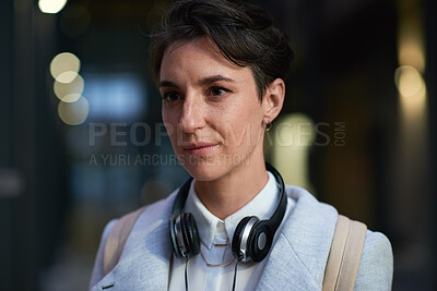 Buy stock photo Night, travel and business woman in city with thinking, brainstorming and career insights. Headphones, commute and person with solution for company future, urban development and job opportunity