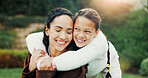 Happy, nature and child hugging mother in park for bonding, love and family on holiday together. Smile, outdoor and girl kid embracing mom for connection, safety or support on weekend in garden.