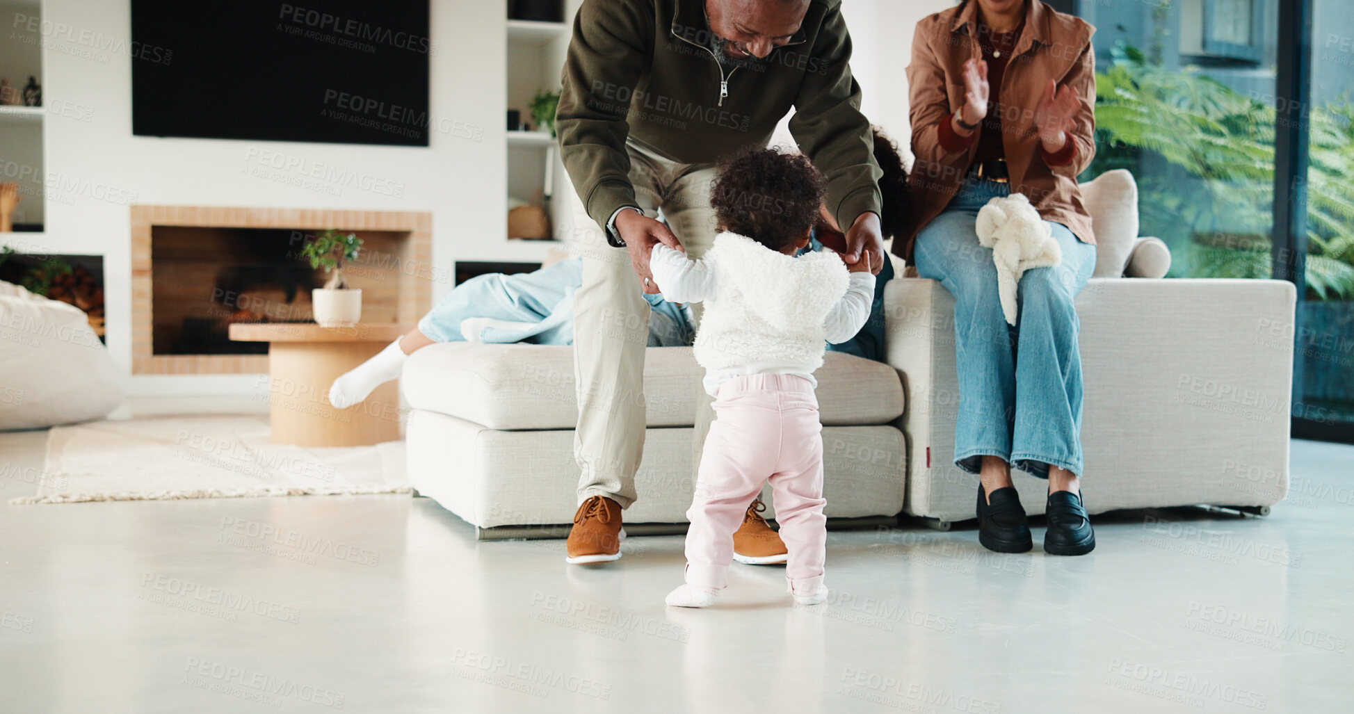 Buy stock photo Parents, baby or walking with help in living room, child development or support for motor skills. Father, applause or people with assistance for infant learning, home or first steps for bonding