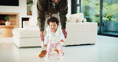 Buy stock photo Father, baby and learning in home with walking support, bonding together or help for child development. Dad, happy daughter and teaching coordination in living room with steps, care or infant growth.