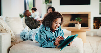 Buy stock photo Tablet, smile and kid relax in home for educational game, elearning and knowledge development. Tech, pen and happy girl on sofa with internet notes, homework research or online course in family house