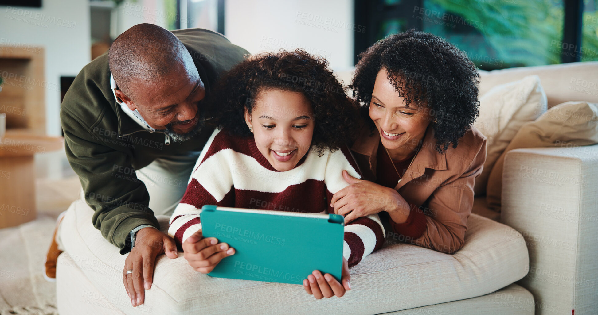 Buy stock photo Relax, love and happy family with tablet in home for bonding, watch movie and streaming with parents. Mother, father and child with technology in living room, subscription service and film on weekend