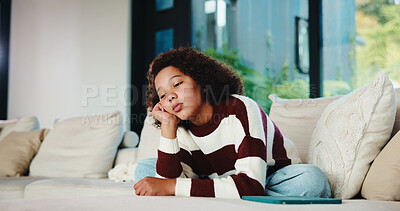 Buy stock photo Bored, tired and teenager on sofa in home with mental health, sad or burnout in living room. Fatigue, unhappy and girl on couch with depression, exhaustion or loneliness in lounge at apartment.