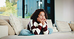 Bored, fatigue and teenager on sofa in home with mental health, sad or burnout in living room. Tired, unhappy and girl on couch with depression, exhaustion or loneliness in lounge at apartment.