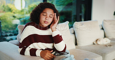 Buy stock photo Frustrated, girl and sofa with headache for eye strain or wrong optometry prescription in home. Child, kid or migraine with glasses on couch for bad vision, overworked sight or massage in house