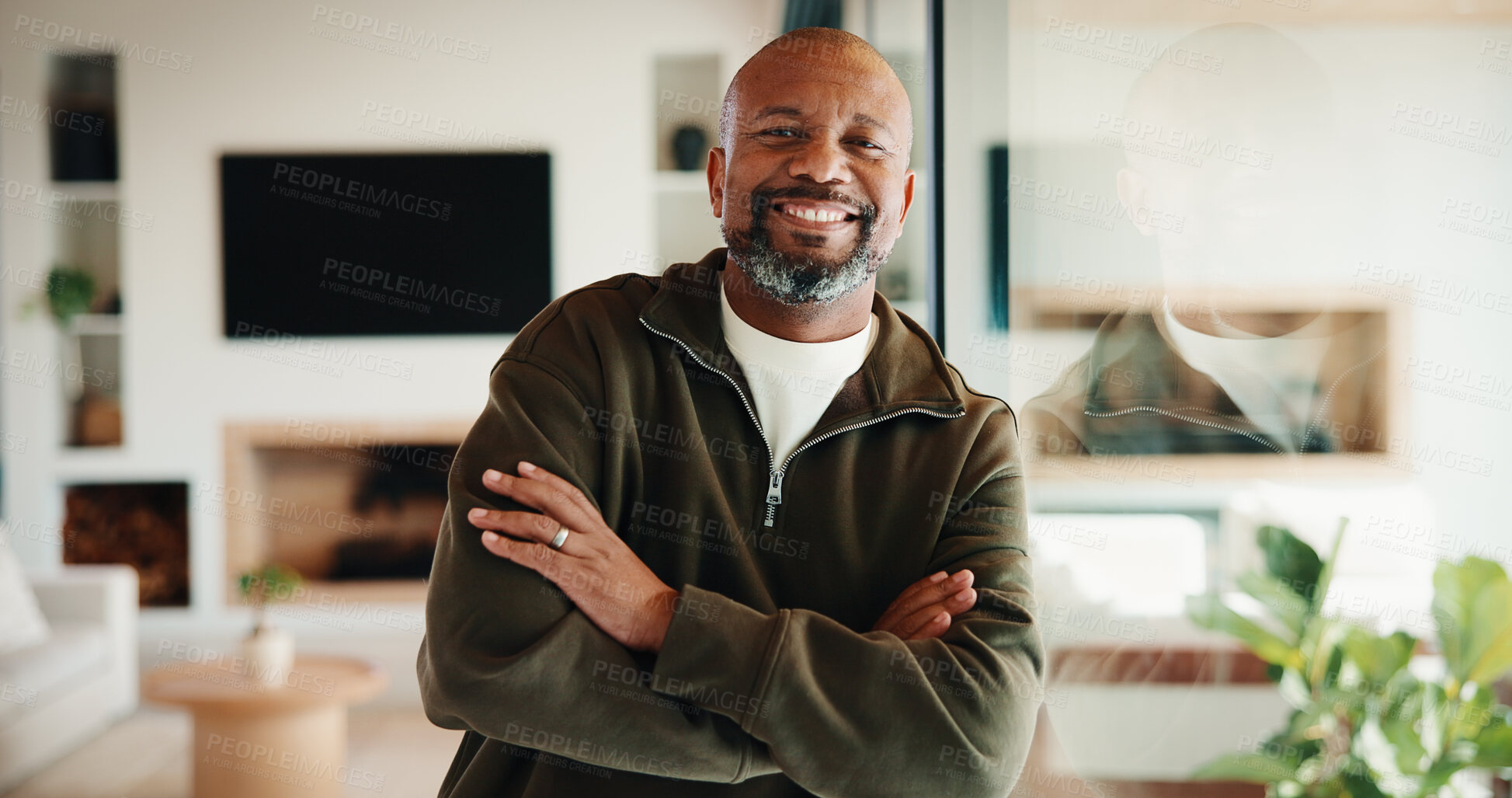 Buy stock photo Portrait, smile and black man by window in home with good mood, arms crossed and chill. Happiness, glass reflection and mature person in living room with positive attitude, relax and break at house