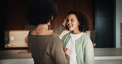 Buy stock photo Mom, girl and happy with greeting in kitchen with touch, help and hair care with love in home. People, single mother and daughter with child for affection, smile and check hairstyle at family house