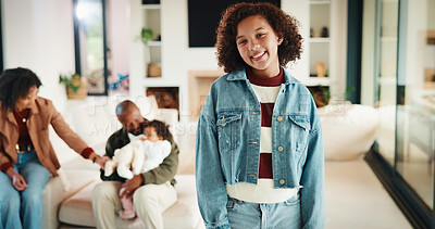 Buy stock photo Child, portrait and smile of girl in home living room with family for development or security. Happy, household and youth with daughter, parents and sibling in apartment together for weekend break