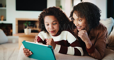 Buy stock photo Happy, mom or kid with tablet on sofa for entertainment, bonding or online subscription in home. Mother, daughter or child lying with technology or app for movie, show or cartoon together in house