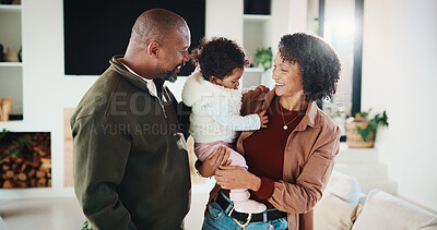 Buy stock photo Happy, family and parents with baby in home, together and bonding with girl on weekend or connection. African people, mom and dad with daughter, laughing and smile for child development in lounge