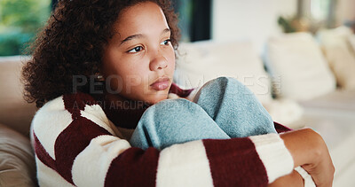 Buy stock photo Unhappy, child and thinking on sofa, home and girl with low self esteem from bullying and bad memory. Remember, trauma and kid with anxiety, sadness and reflection on insecurity and mental health