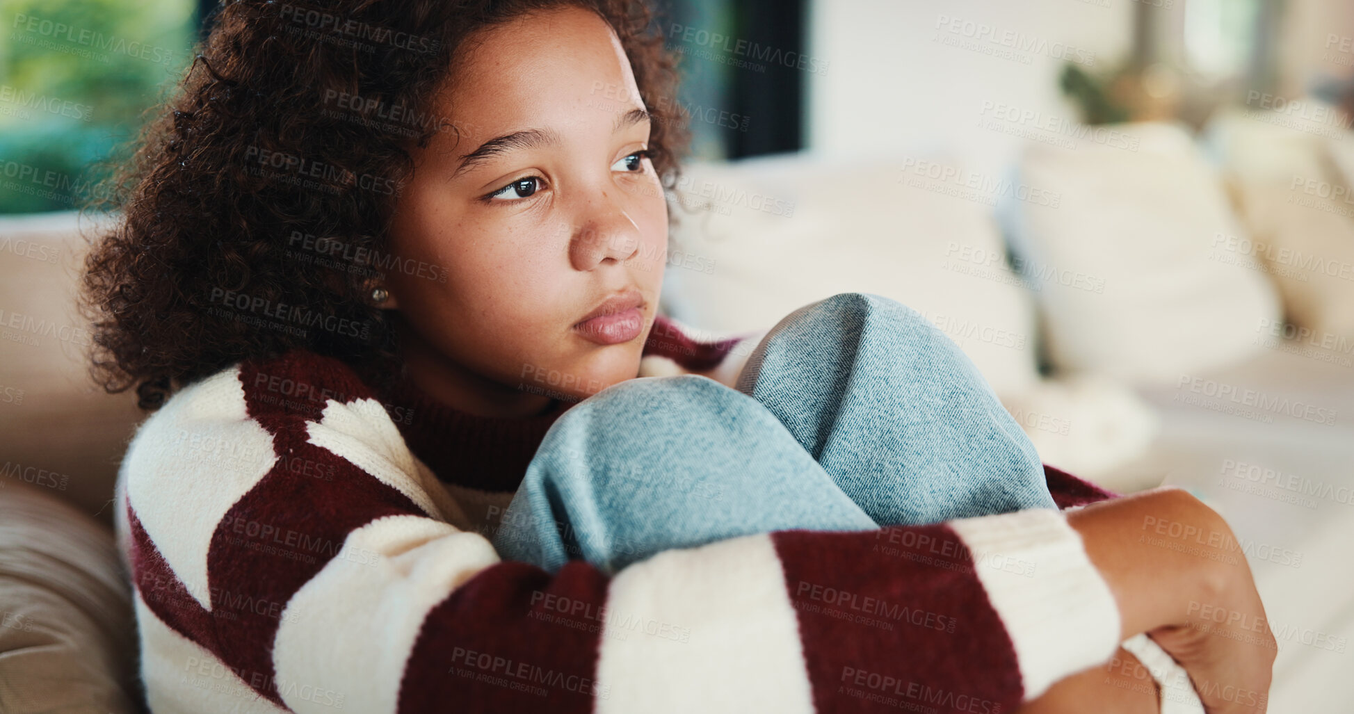 Buy stock photo Unhappy, child and thinking on sofa, home and girl with low self esteem from bullying and bad memory. Remember, trauma and kid with anxiety, sadness and reflection on insecurity and mental health