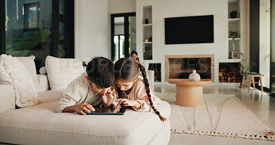 Buy stock photo Family, relax and tablet with children on sofa in living room of home for learning or online streaming. App, development and scrolling with sibling kids in apartment together for educational gaming