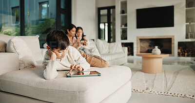 Buy stock photo Family, relax and boy on tablet in living room for movies, streaming or internet show for entertainment. Parents, child and digital tech for social media, play and app in home for weekend together