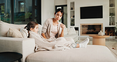 Buy stock photo Mom, girl and thermometer with blanket in home for illness, fever and check temperature in living room. People, mother and daughter with rehabilitation, sick and recovery with healing at family house