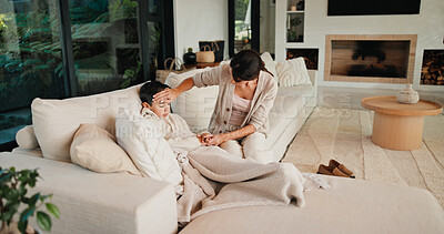 Buy stock photo Sick child, care and mother in home to check temperature, love and holding hands for support. Mom, disease and boy in living room with cold, virus infection or help with fever for health risk on sofa