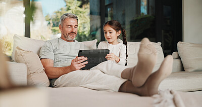 Buy stock photo Father, child and bonding in home with tablet, website or educational game for cognitive development. Family, dad and daughter learning in living room with tech, digital app or connection for growth.