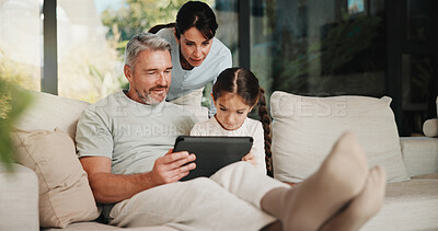 Buy stock photo Family, relax and man on tablet in living room for movies, streaming or internet show for entertainment. Parents, girl and digital tech for social media, game and app in home for weekend together