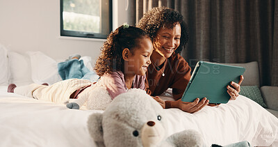 Buy stock photo Tablet, child and happy mother in bed for relax, watch movie and bonding together with parent. Technology, mom and girl in bedroom at family home for streaming cartoon, show and smile with daughter