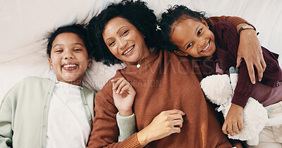 Buy stock photo Portrait, cuddle and mother with children in bed, support and affection for relationship development. Relax, home and happy woman with girls for connection, bonding and teddy bear for family time