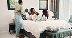 Parents, laugh and playing with children in bedroom for fun, holiday break and bonding together. Smile, people and kids jump on bed for excitement, weekend activity and parenthood with games at house