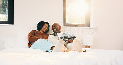 Buy stock photo Love, relax and couple with laughing in bedroom, emotional connection and humor for weekend bonding. Home, comfortable and mature African people with funny joke for relationship, resting or happiness