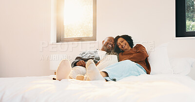 Buy stock photo Cuddle, relax and couple with laughing in bedroom, emotional connection or humor for weekend bonding. Home, comfortable or mature African people with funny joke for relationship, resting or happiness