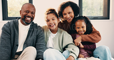 Buy stock photo Portrait, parents and smile with children at house for love, holiday break and bonding together. Happy, people and kids laughing with embrace, weekend activity and affection for parenthood in lounge