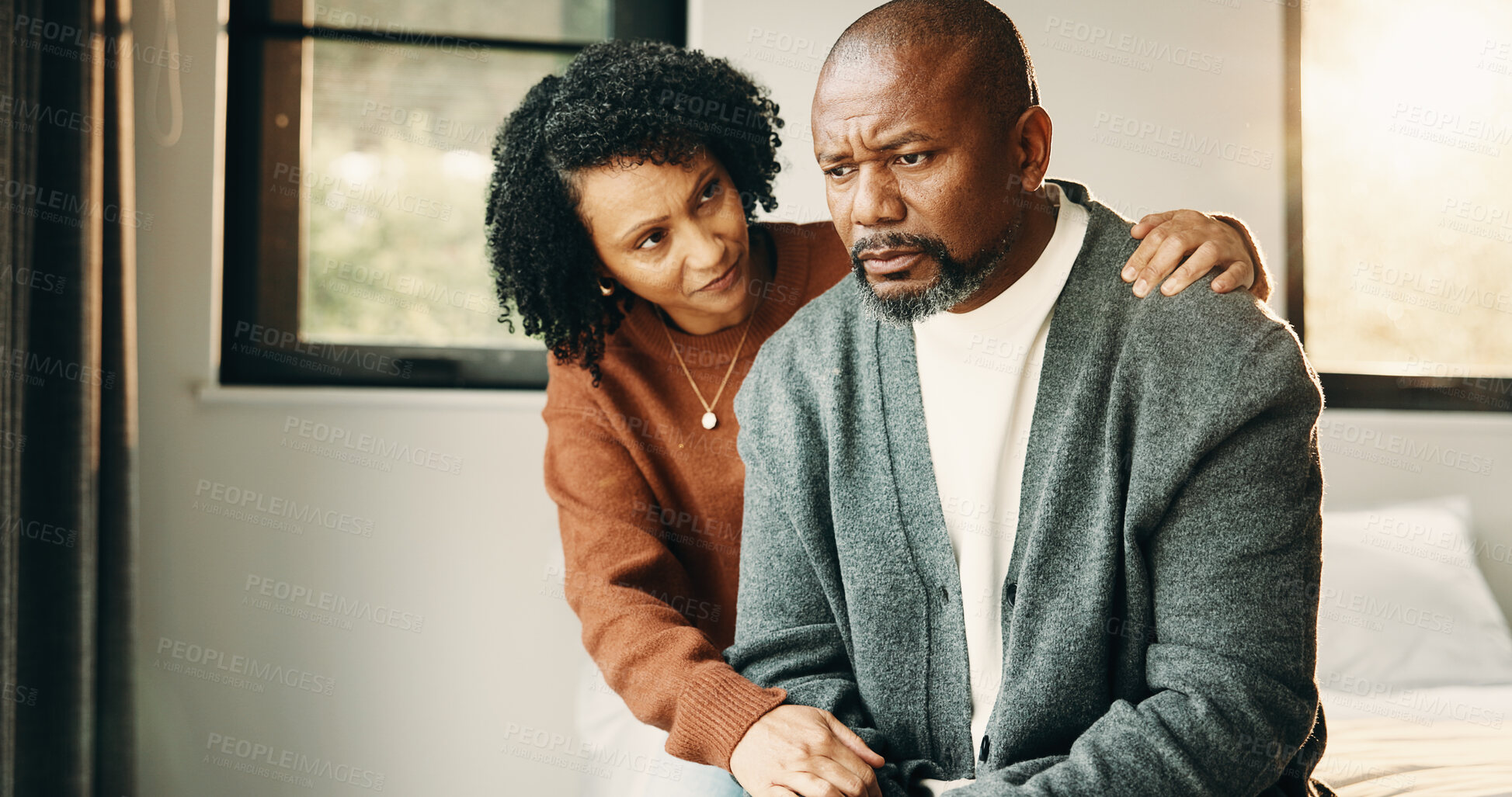 Buy stock photo Couple, empathy and man with stress in bedroom, financial crisis and thinking of unemployment or sad. African woman, home and comfort with shoulder touch, mature people and guilt for job loss on bed