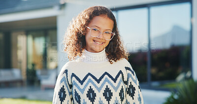 Buy stock photo Portrait, girl or child in backyard with smile, glasses and pride for moving to new home on weekend. Happy, kid and relax at outdoor with spectacles, positive attitude and relocation to dream house.