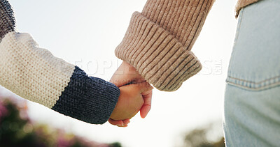 Buy stock photo Love, parent or child outdoor with holding hands, bonding together or support in childcare. Back, mother or kid with trust, healthy relationship or family connection for childhood development.