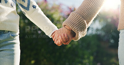 Buy stock photo Love, parent or kid outdoor with holding hands, bonding together or support in childcare. Flare, space or child with trust, healthy relationship or family connection for childhood development.
