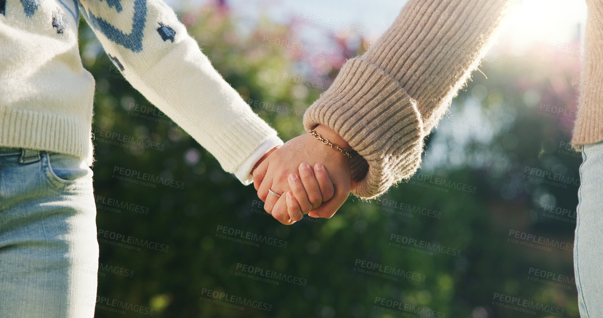 Buy stock photo Love, parent or kid outdoor with holding hands, bonding together or support in childcare. Flare, space or child with trust, healthy relationship or family connection for childhood development.