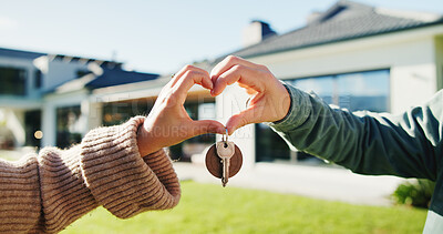 Buy stock photo Couple, key and moving in backyard with heart hands, bonding and real estate purchase of new home. Outdoor, married people and keychain with love sign, relocation success or property investment goals