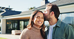 Happy, couple and kiss in backyard with new home, bonding together and property investment success. Married people, outdoor and moving in dream house with affection, relocation and real estate goals.