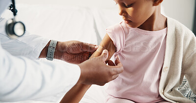 Buy stock photo Healthcare, hands and plaster for child in hospital, wellness and infection prevention after vaccine. Clinic, pediatrician and person with bandage for kid, checkup and medical help for immune system