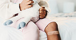 Plaster, child and hands in home with first aid for wellness, wound protection and toy for comfort. Sad emoji, teddy bear and kid with bandage for injury healing process, health and recovery support