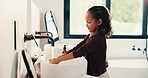 Bathroom, child and washing hands for hygiene, health and bacteria removal for safety in morning. Girl, water and cleaning fingers at sink for wellness, germ prevention and disinfection at home