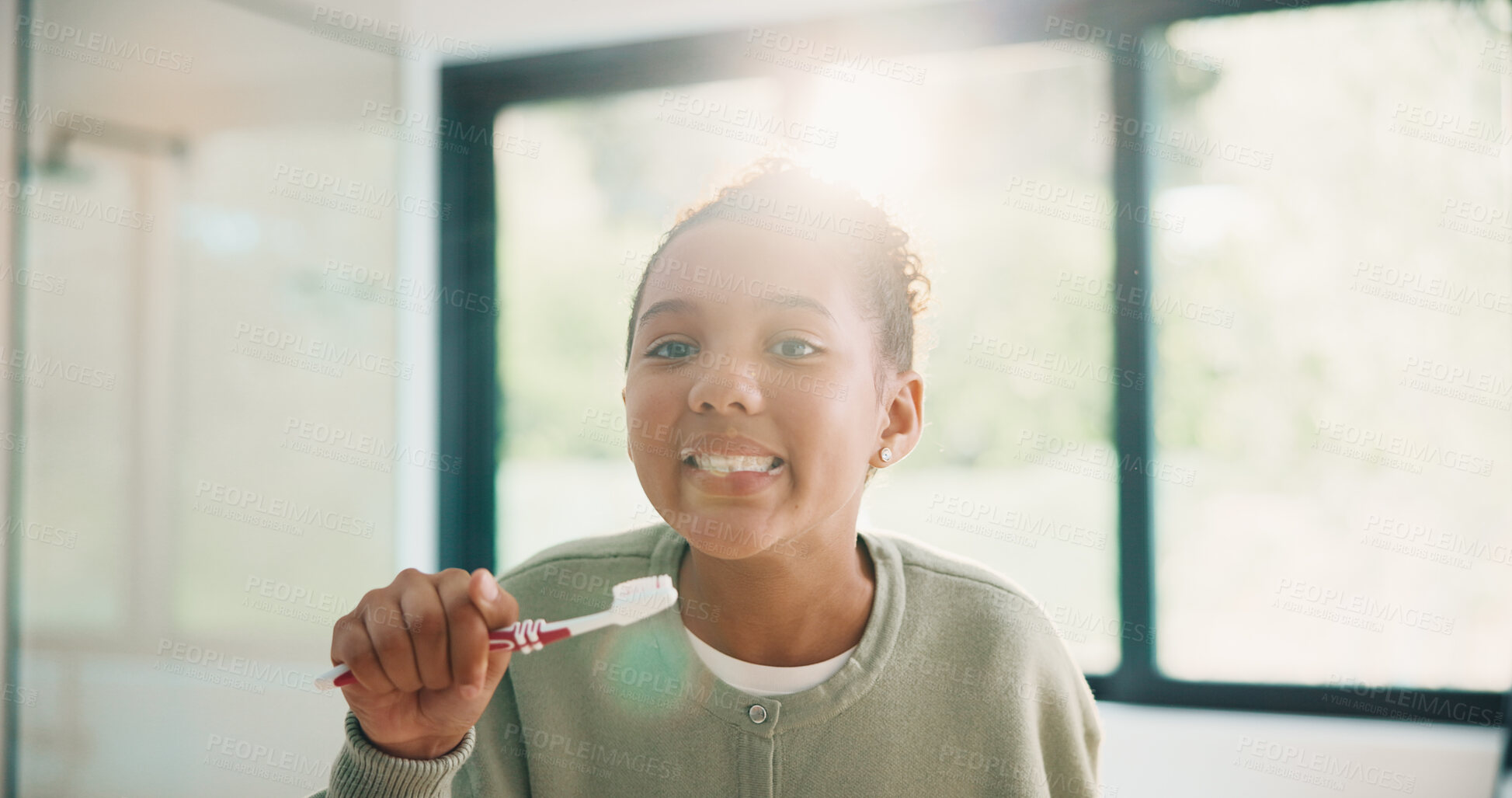 Buy stock photo Child, brushing teeth or dental health in bathroom, portrait or oral hygiene in morning routine. Toothbrush, clean or girl at home for fresh breath with gum care, mouth wellness and smile with flare