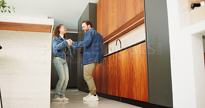 Buy stock photo Dad, daughter and dancing in kitchen for bonding, energy or vibe together in fun home. Father, child or holding hands with kid, support or love for morning weekend, care or family time in house