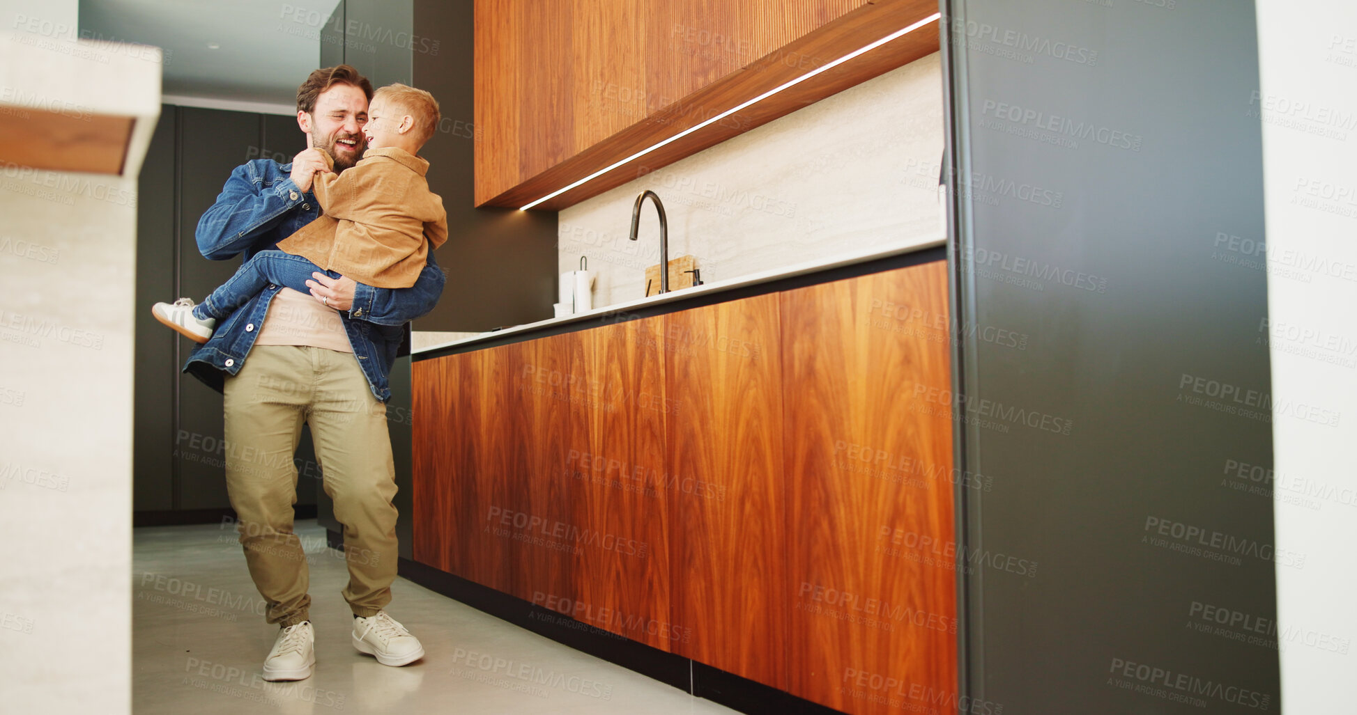 Buy stock photo Dance, energy and smile of man with son in home kitchen for family bonding or playing. Holding hands, laughing and playful father with excited boy child in apartment for development or security